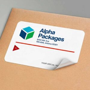 Printed shipping label for small business packages Thermal shipping labels on parcel box Small business shipping label being applied to package High-quality shipping label with barcode and address